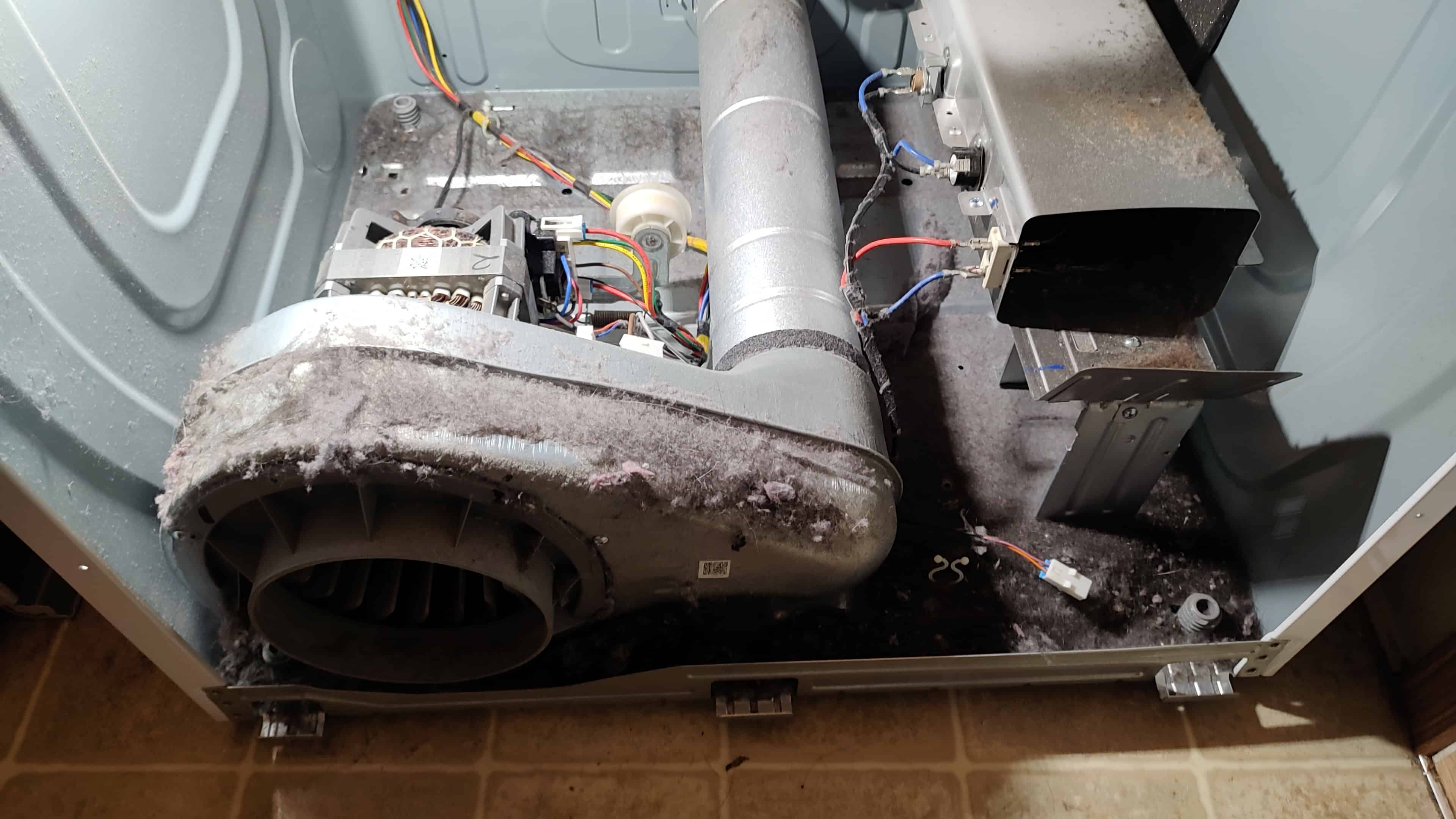 Samsung dryer inside before repair with lint buildup and airflow restriction
