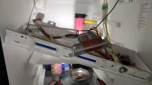 Whirlpool fridge control panel during repair
