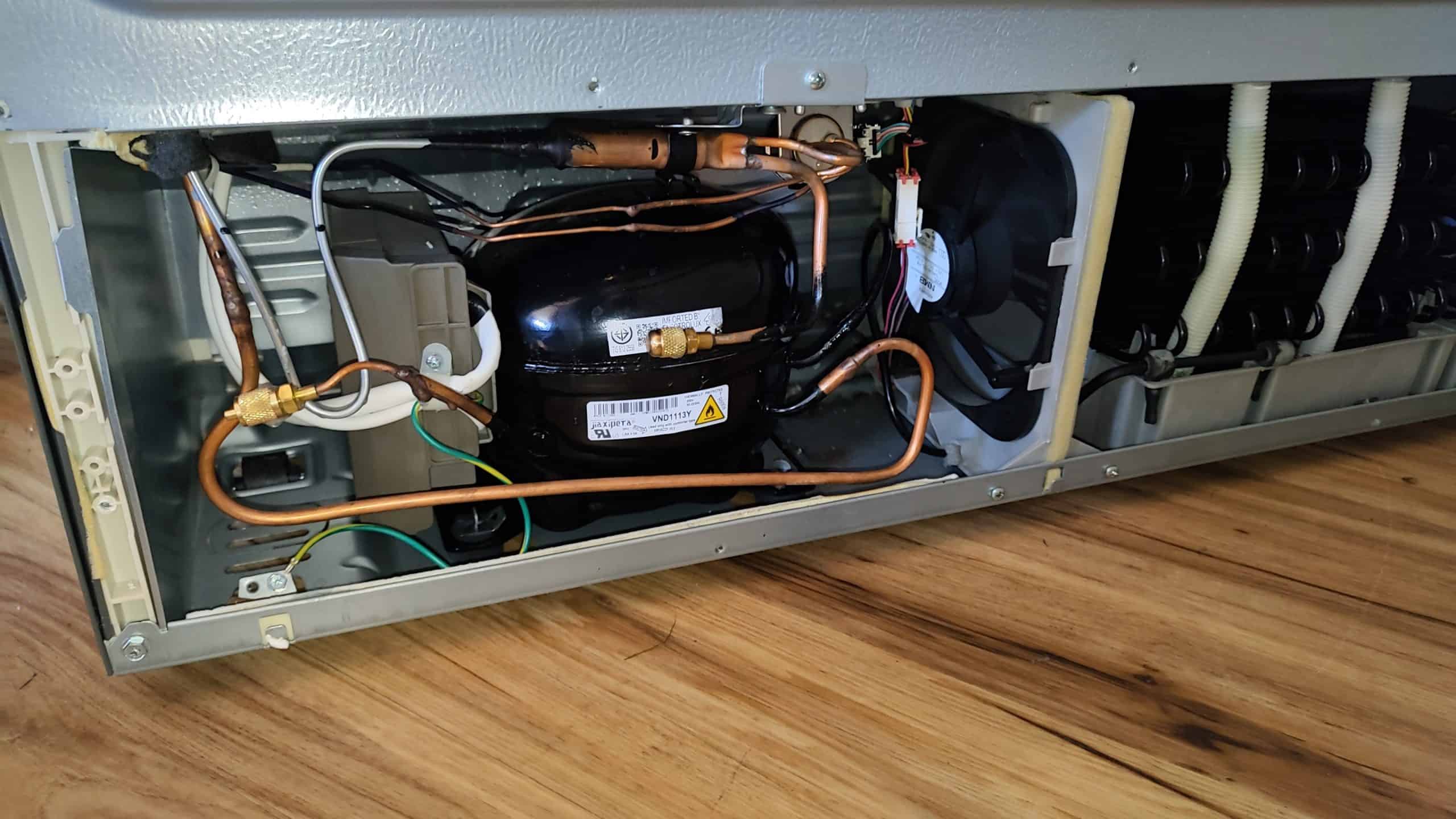 Final sealed-system assembly after Frigidaire condenser replacement