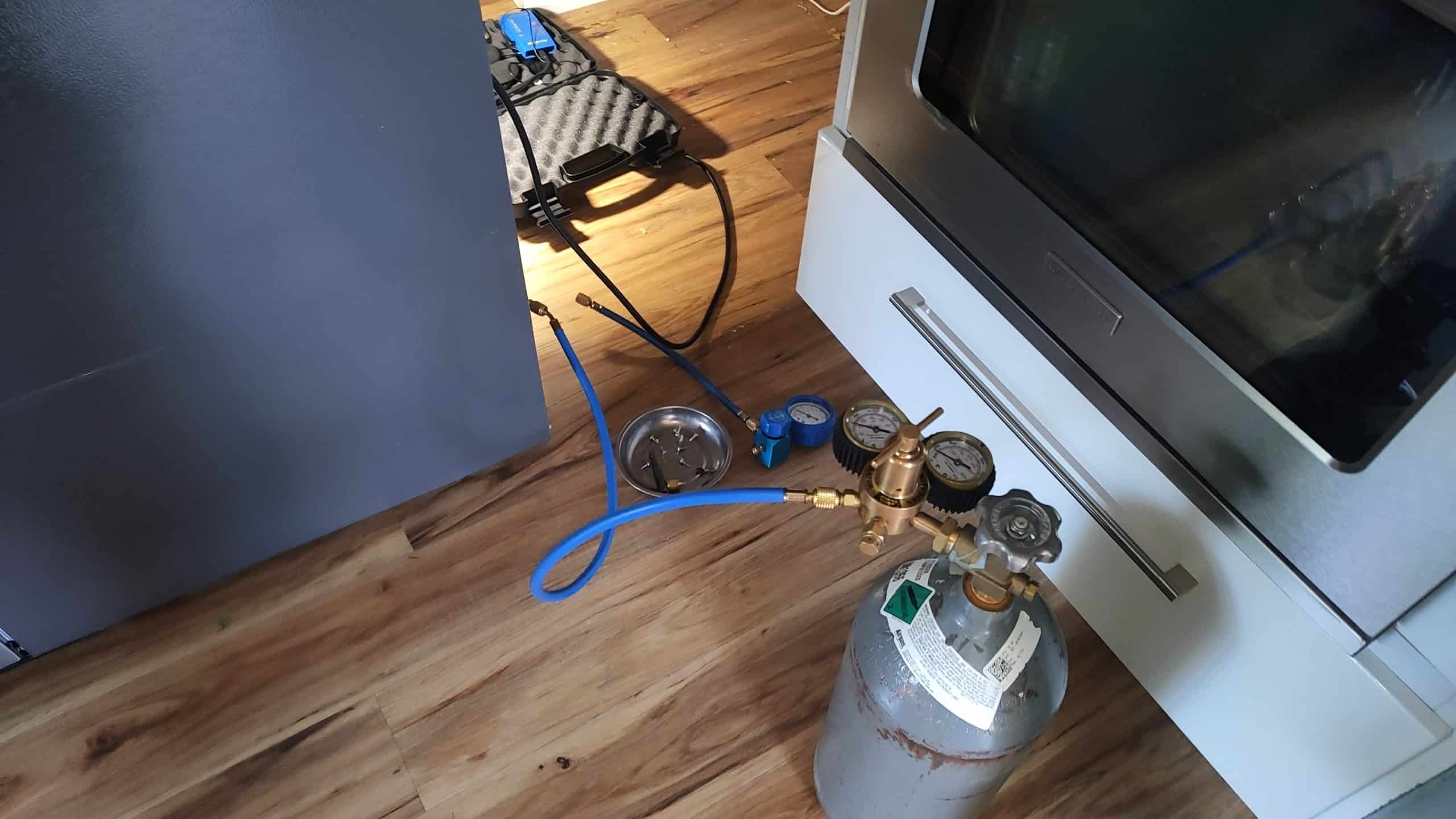 Nitrogen pressure test during Frigidaire refrigerator sealed-system repair