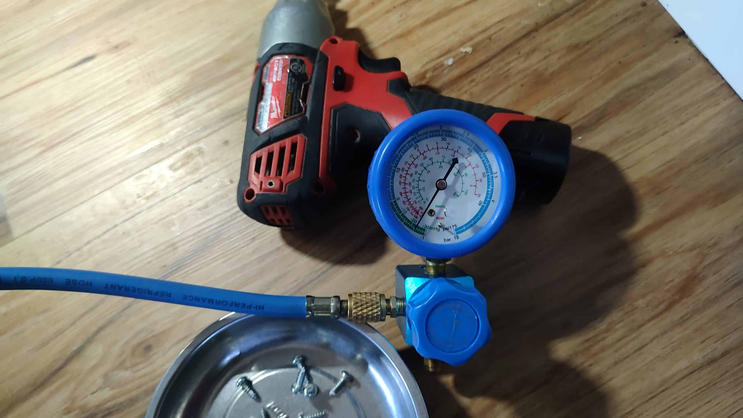 R600a gauge hookup during Frigidaire refrigerator sealed-system repair