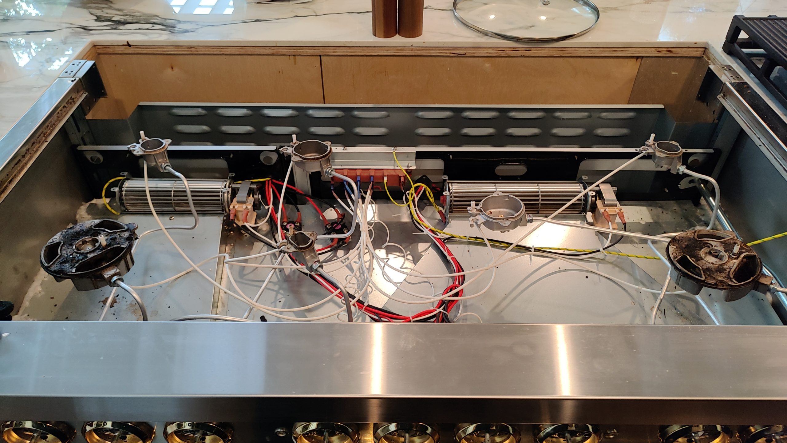 ZLINE RA48 cooktop internal components exposed during repair