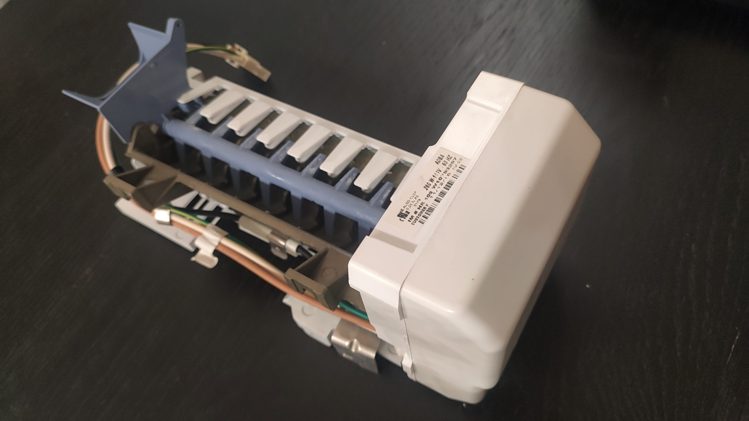 120V Self-Contained Refrigerator Ice Maker Assembly Removed Removed 120V self-contained refrigerator ice maker assembly with shutoff arm and water-fill tube.