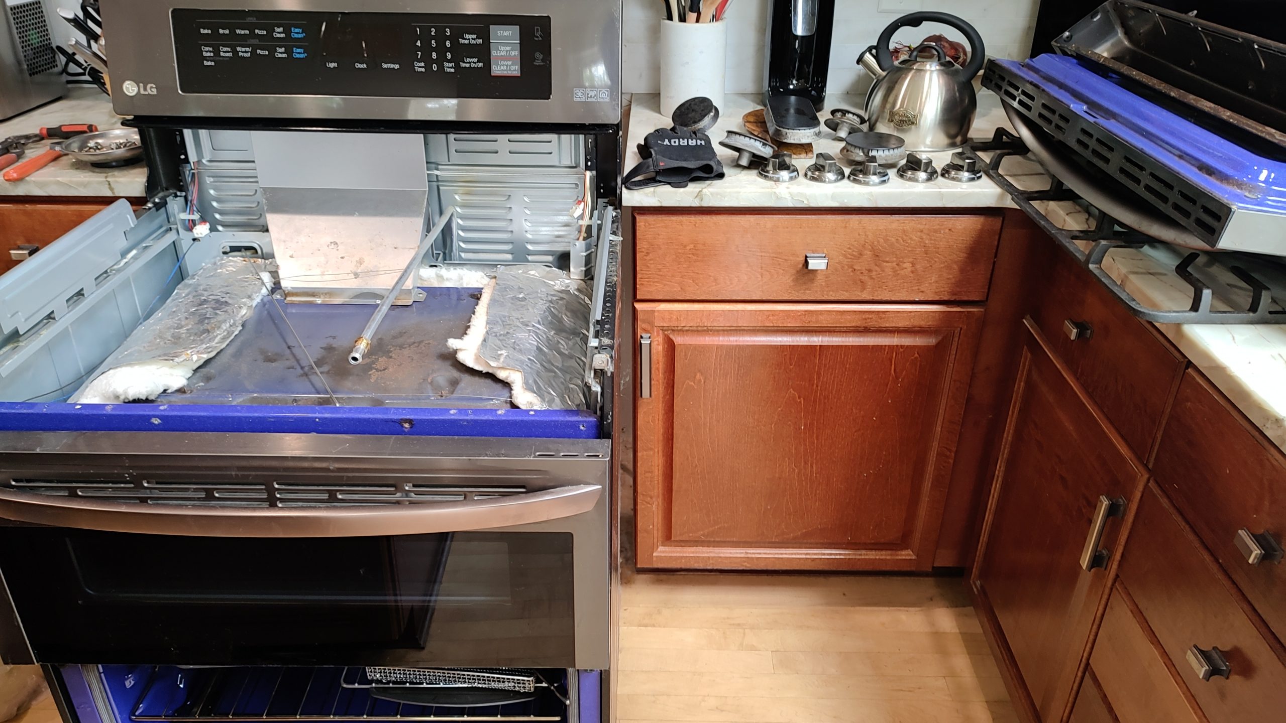 Disassembled LG gas range during oven insulation repair in Camas WA