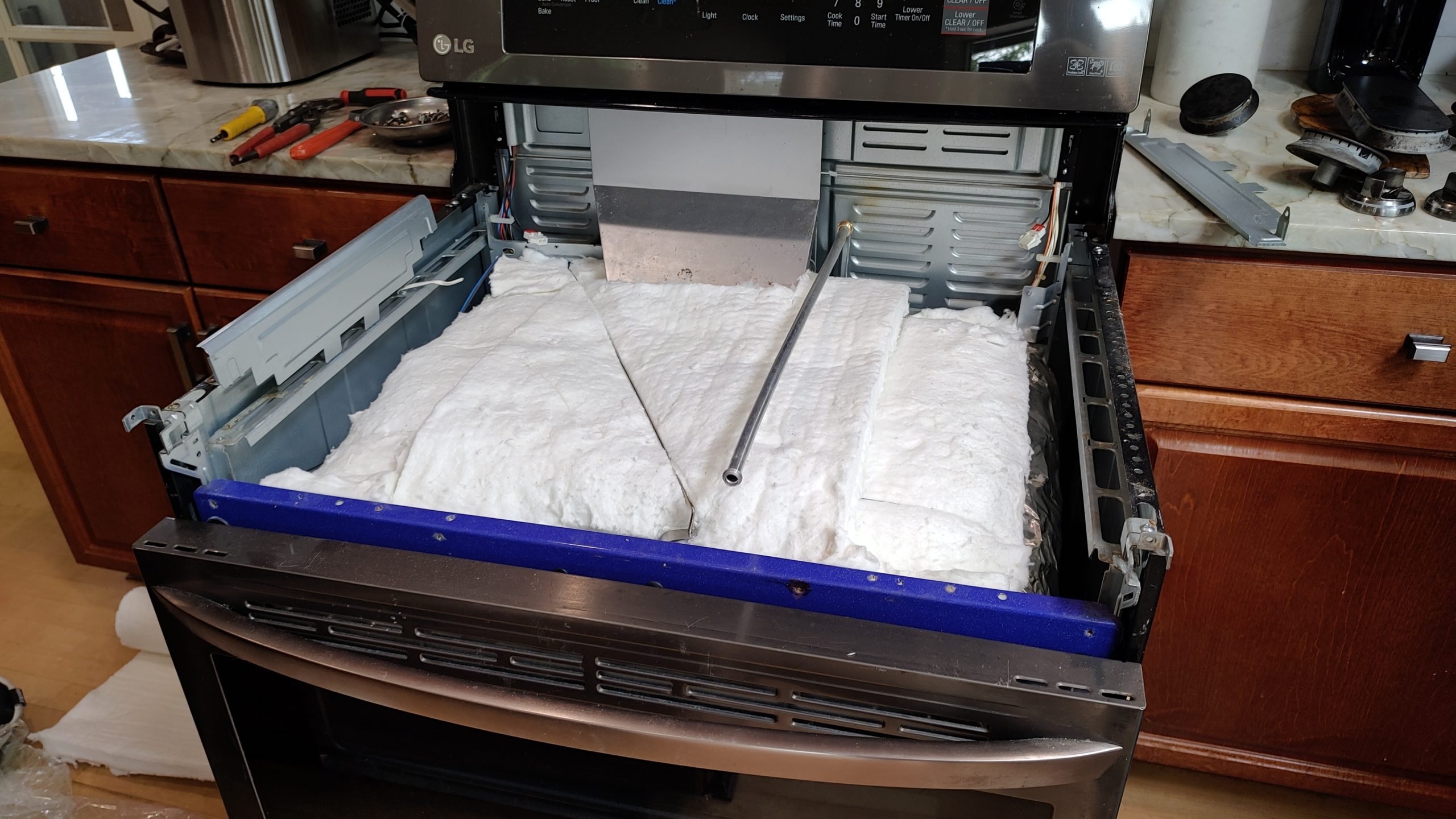New oven insulation installed inside LG gas range during repair in Camas WA