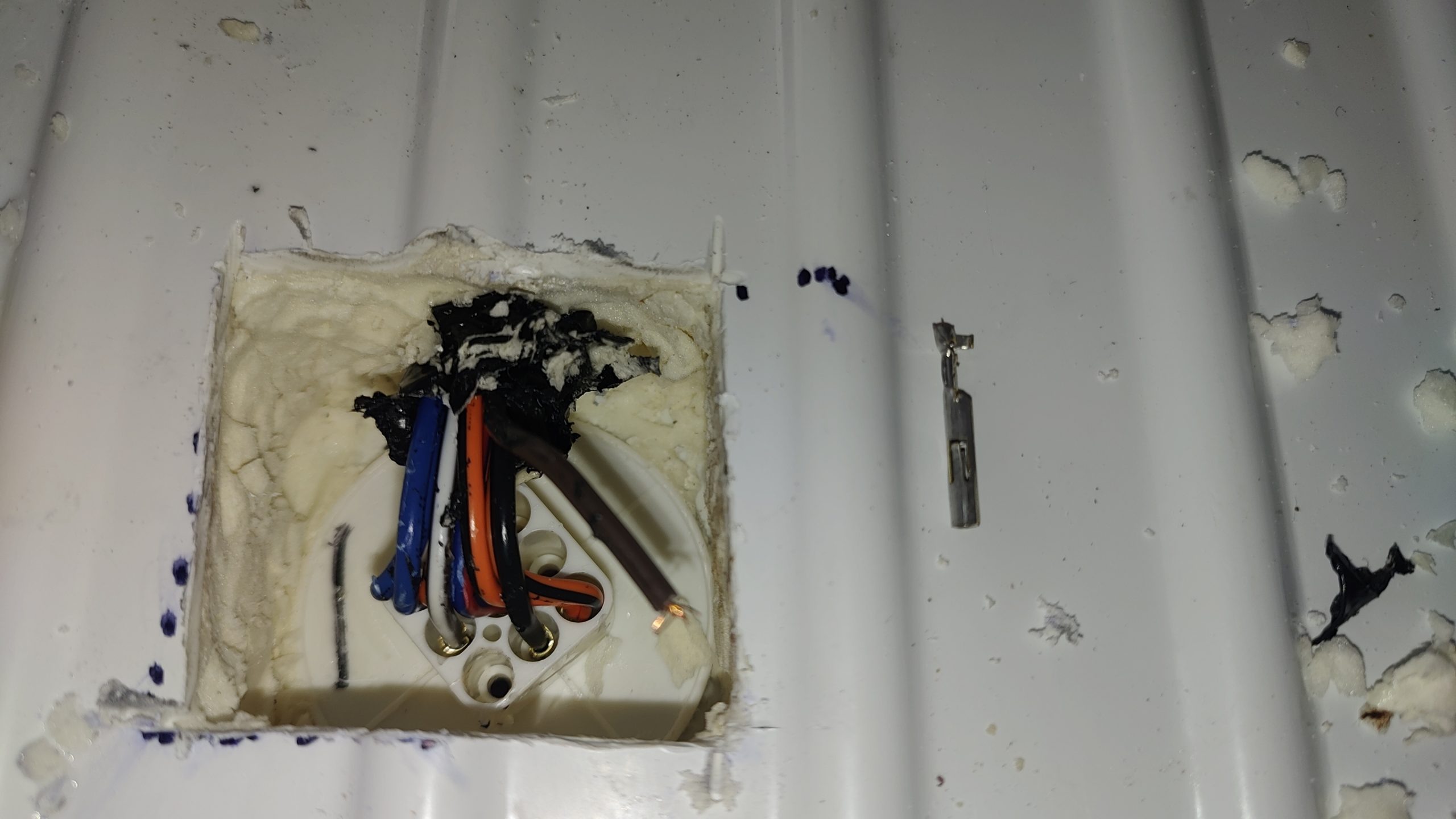GE Refrigerator Completely Dead — A Power Wire Broke Inside the Cabinet 4 Broken brown power wire beside a hidden GE refrigerator connector