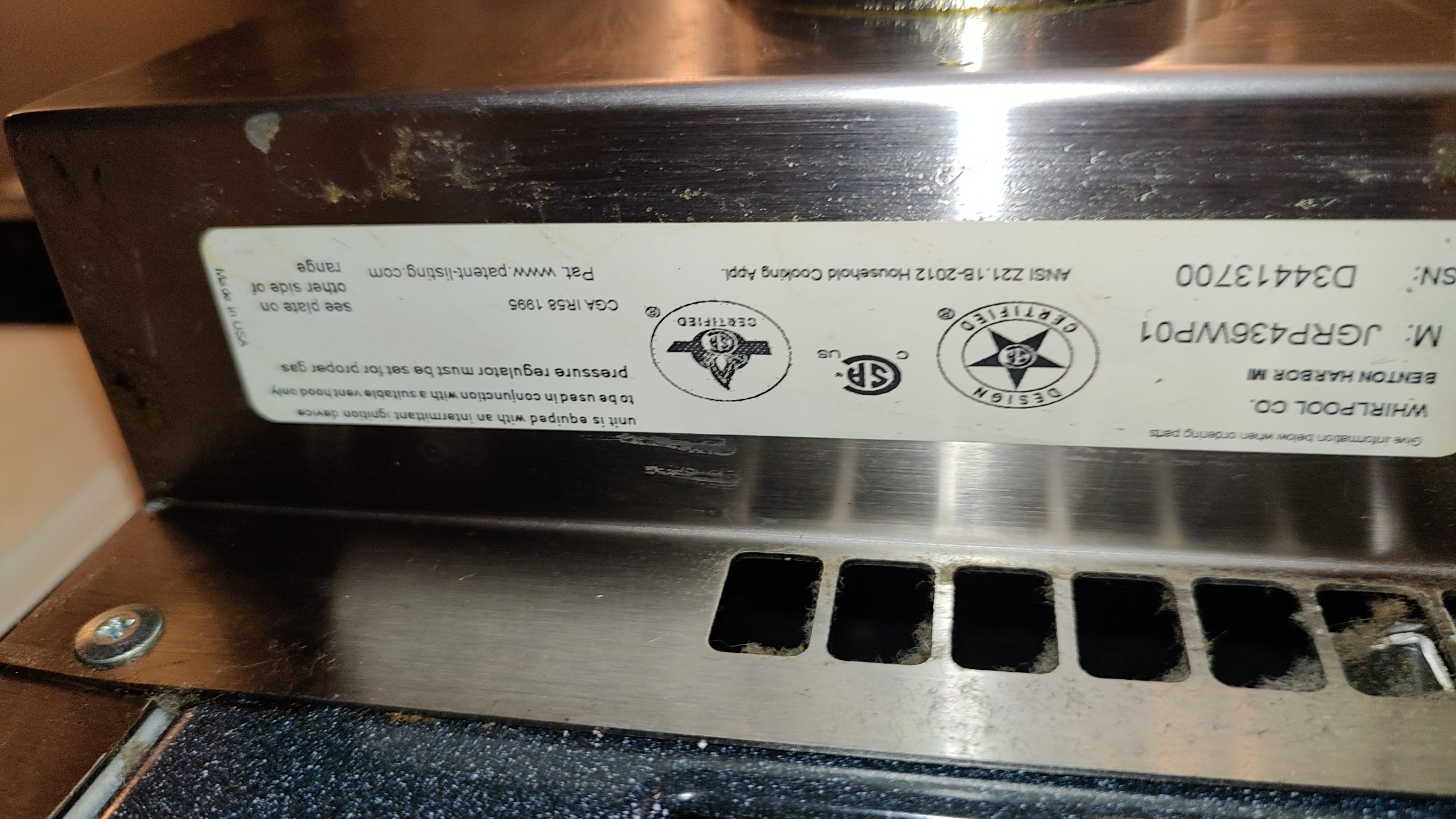 Model and serial tag on a JennAir gas range showing model JGRP436WP01.