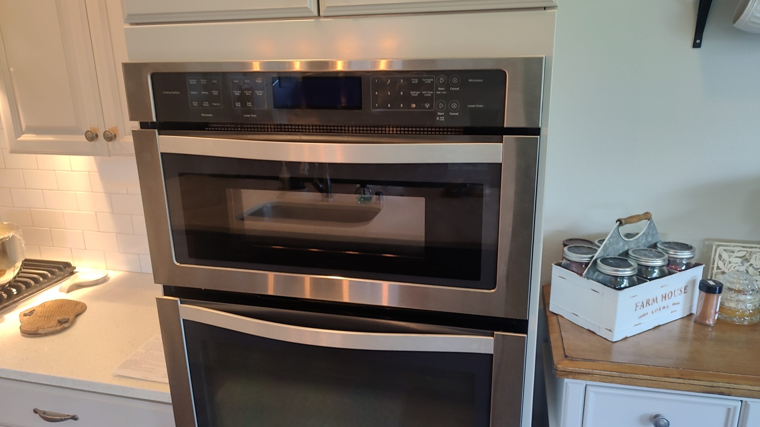 Whirlpool WOC97ES0ES02 built-in microwave and wall oven after the microwave door repair was completed