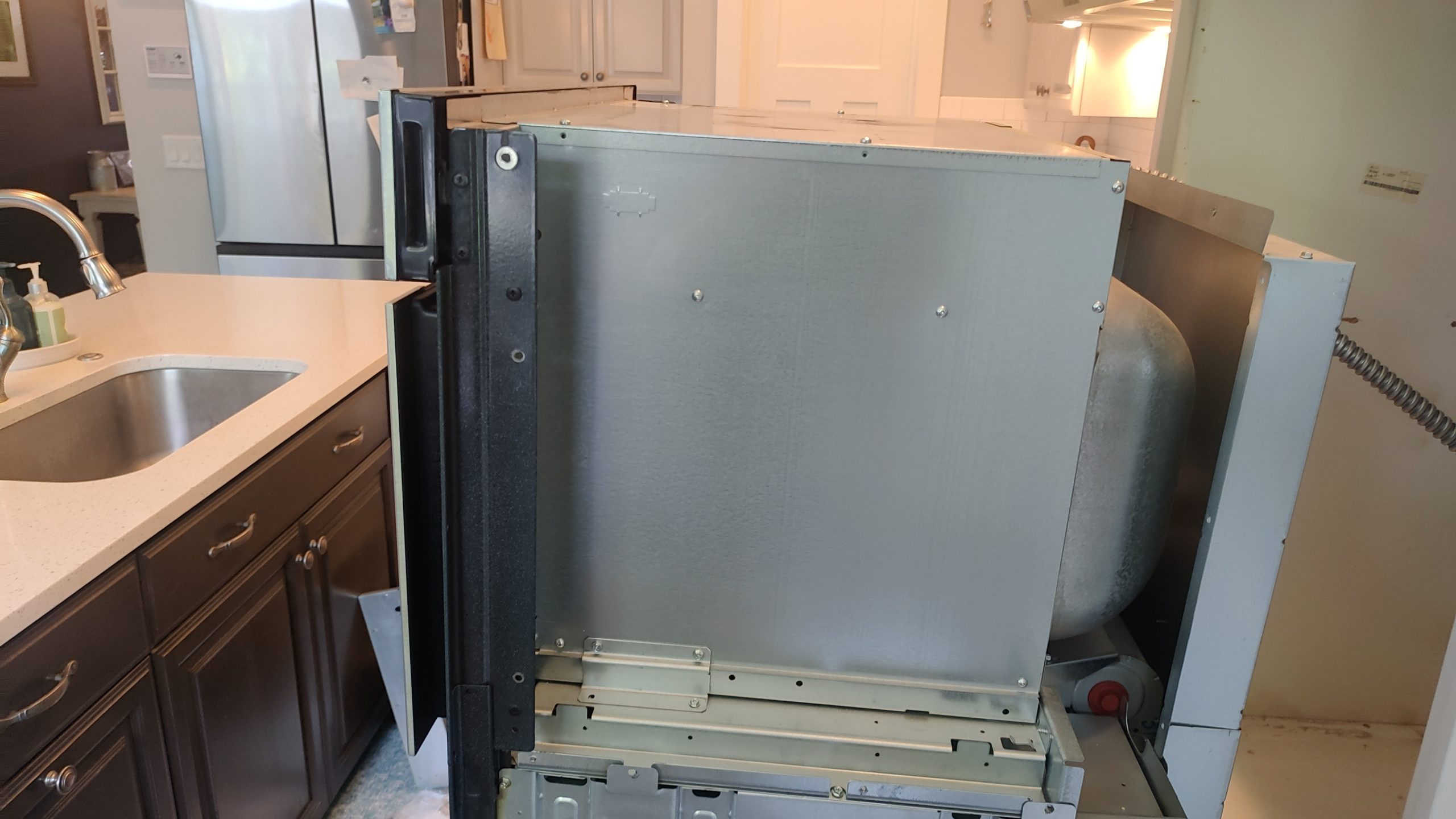 Whirlpool WOC97ES0ES02 wall oven and microwave combination pulled out of the kitchen cabinet for repair